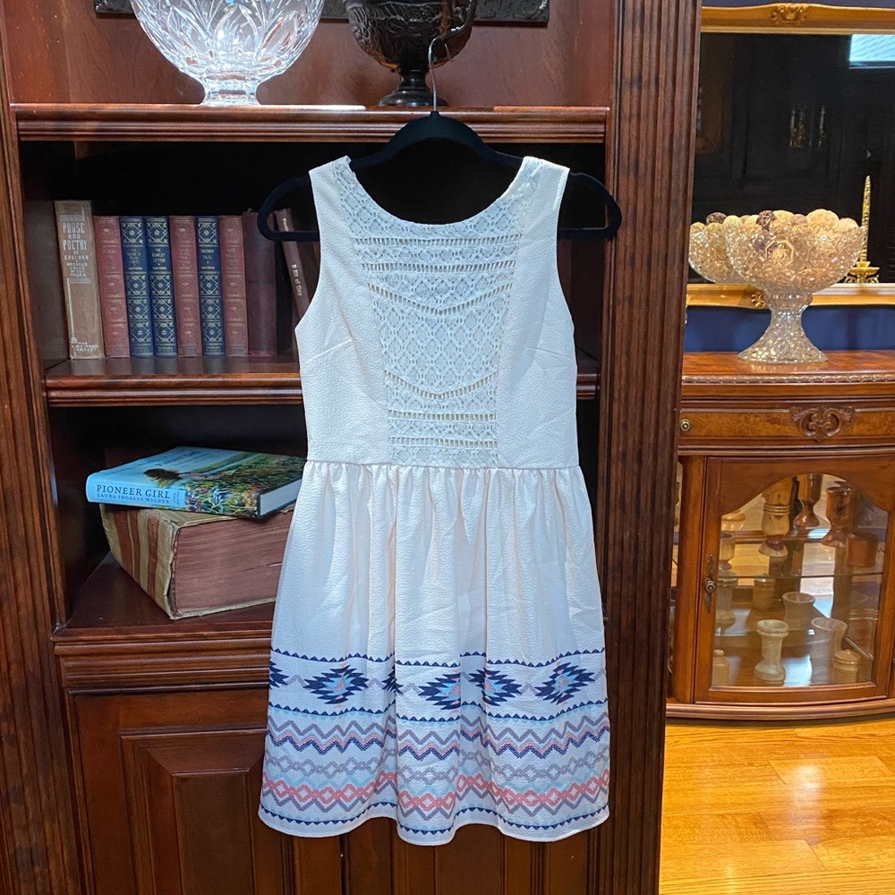 Cream colored and patterned dress